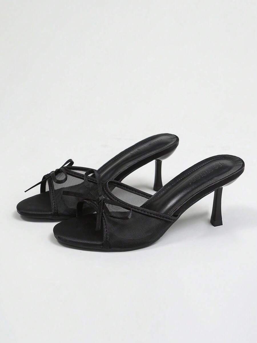 Women's black open toe mesh slide sandals with bowknot detail and stiletto heels