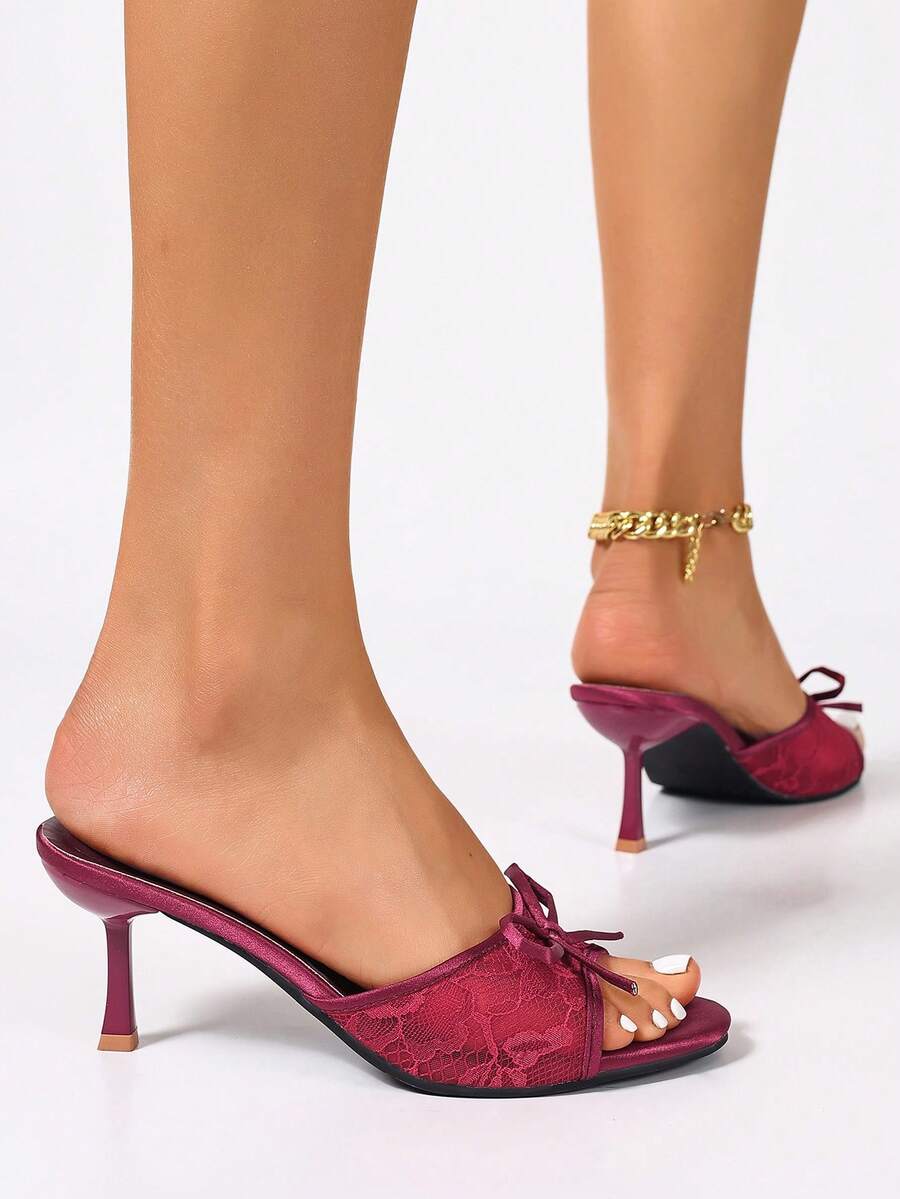 Women's black open toe mesh slide sandals with bowknot detail and stiletto heels