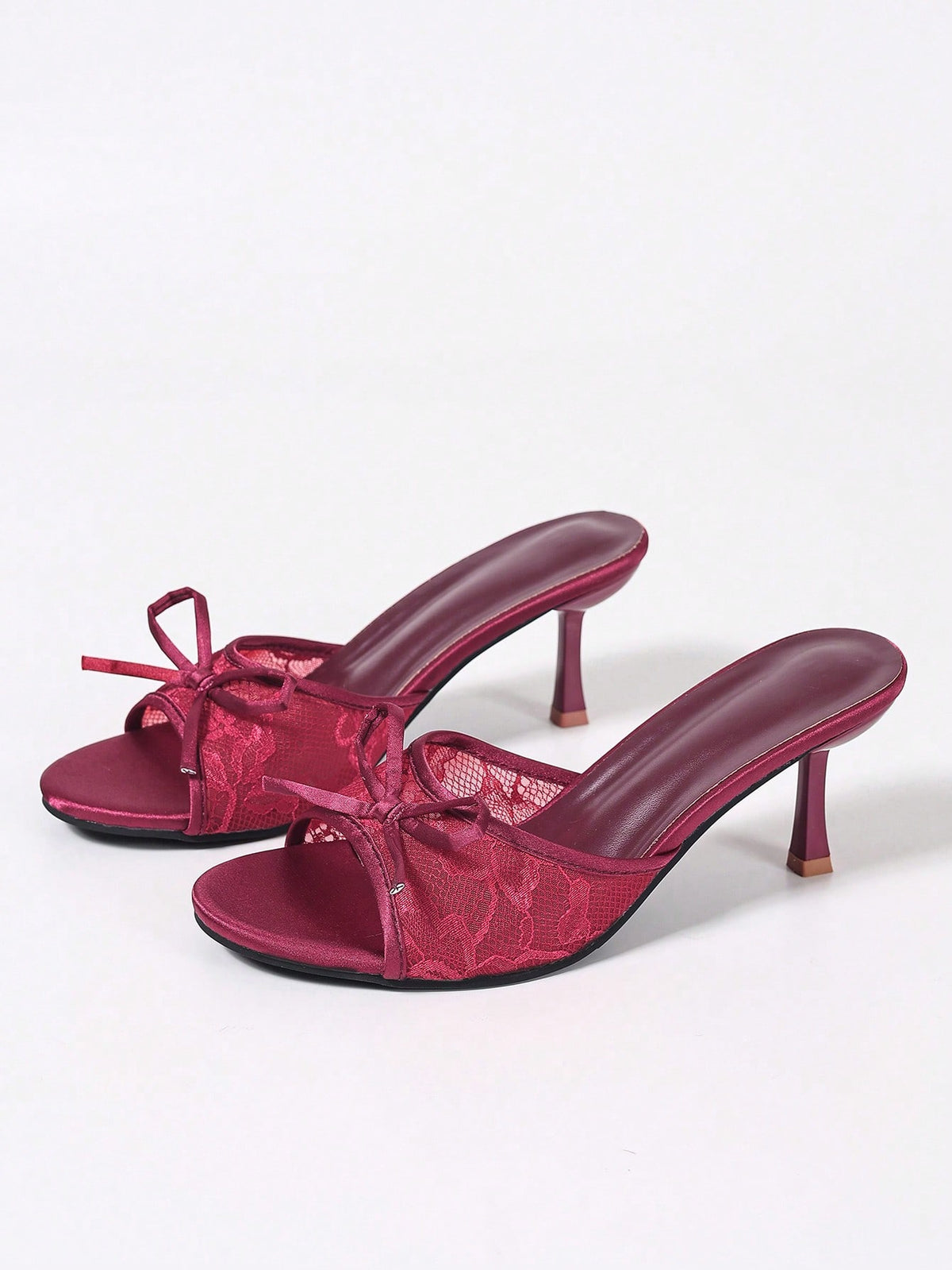 Women's black open toe mesh slide sandals with bowknot detail and stiletto heels