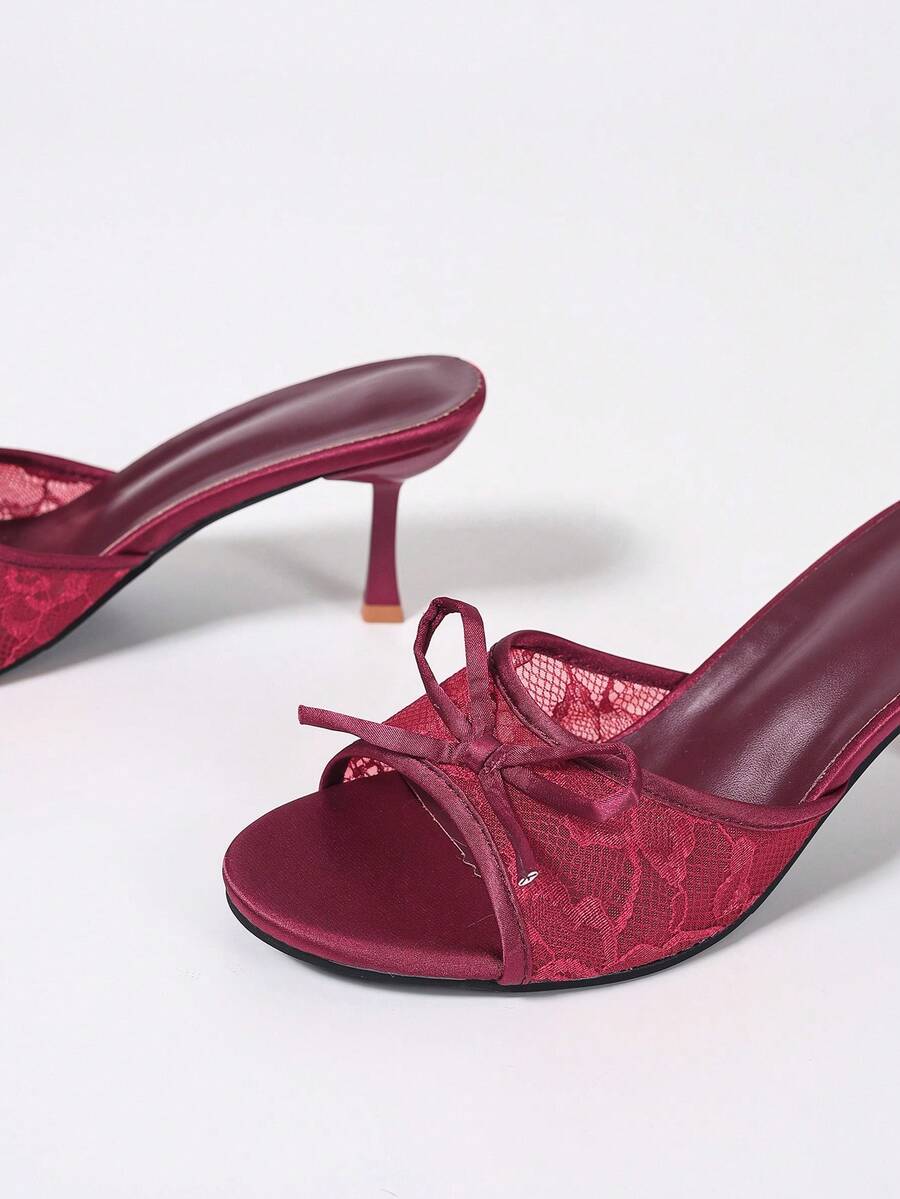 Women's black open toe mesh slide sandals with bowknot detail and stiletto heels