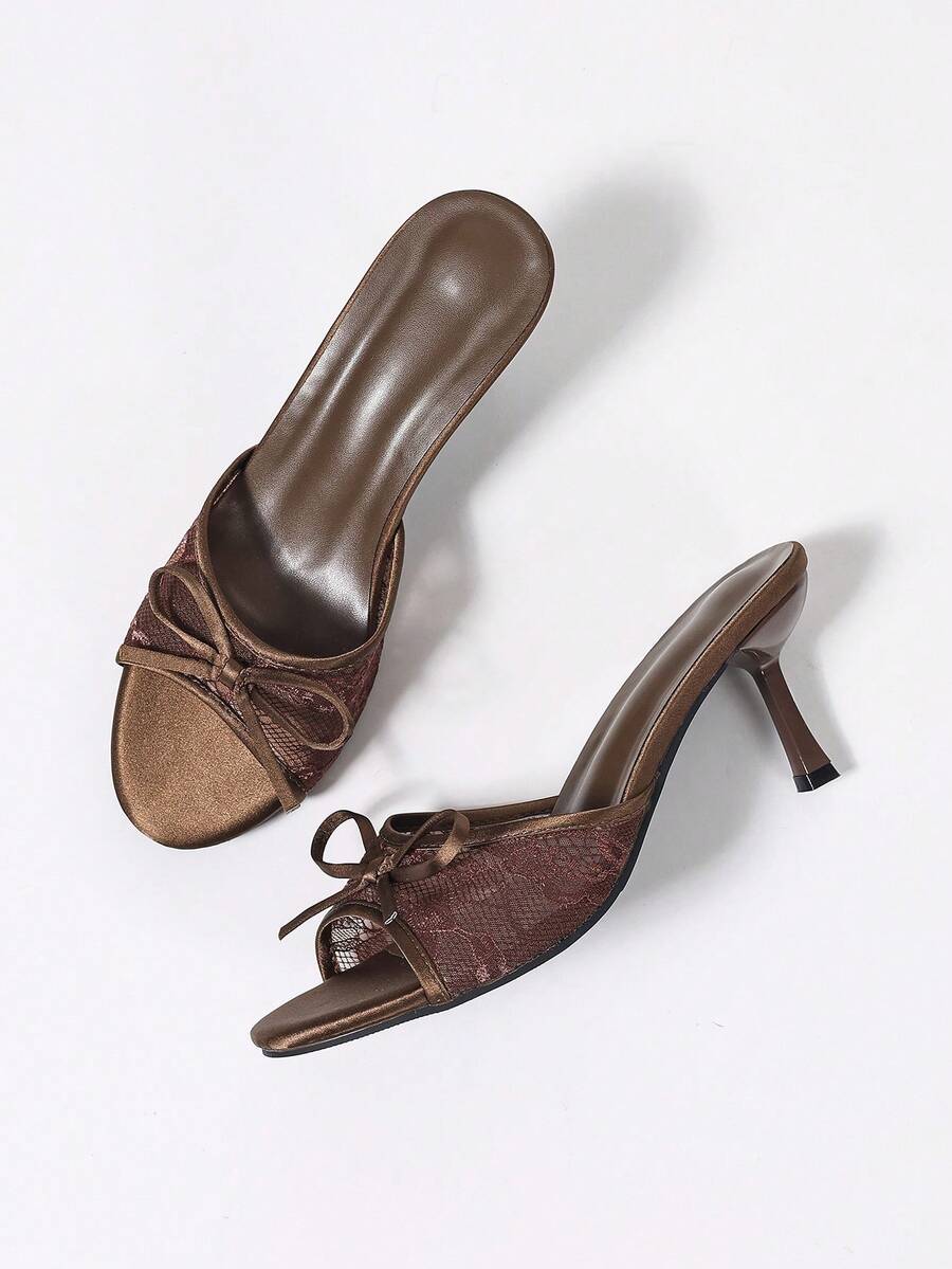Women's black open toe mesh slide sandals with bowknot detail and stiletto heels