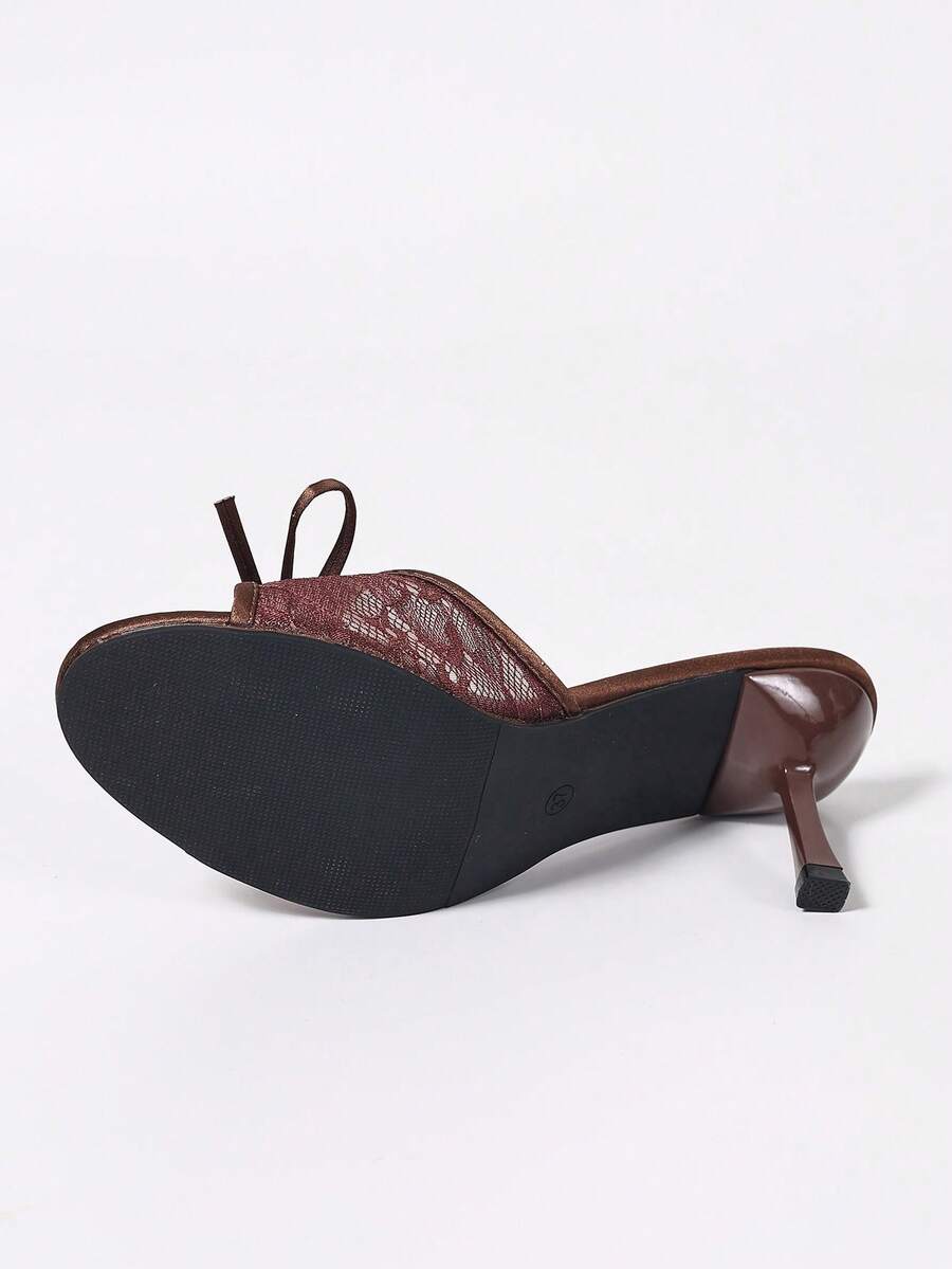 Women's black open toe mesh slide sandals with bowknot detail and stiletto heels