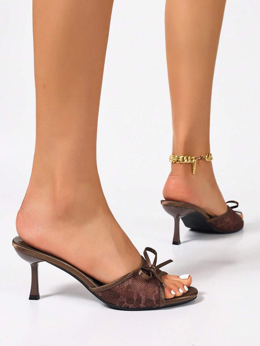 Women's black open toe mesh slide sandals with bowknot detail and stiletto heels