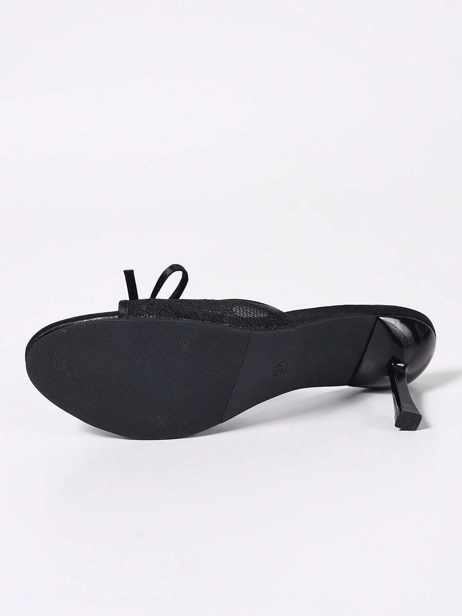 Women's black open toe mesh slide sandals with bowknot detail and stiletto heels