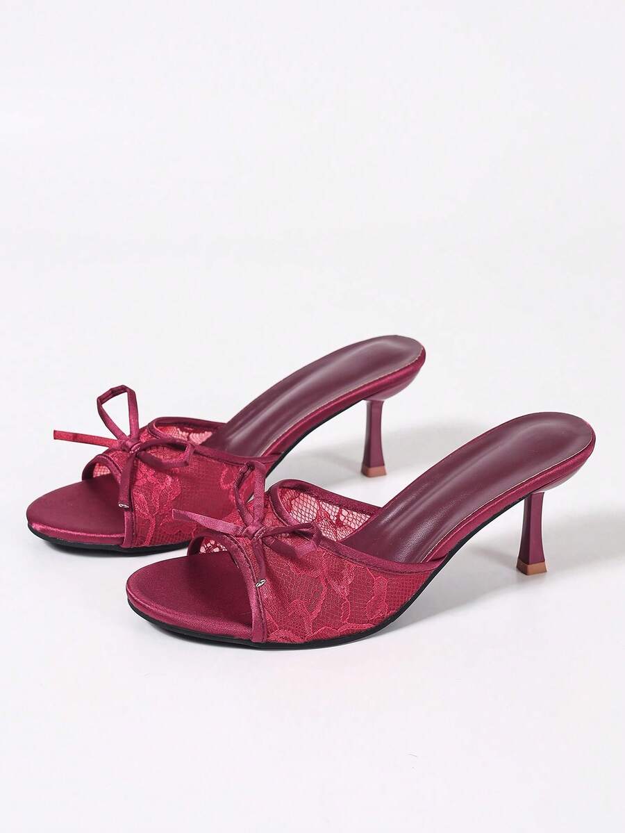 Women's black open toe mesh slide sandals with bowknot detail and stiletto heels