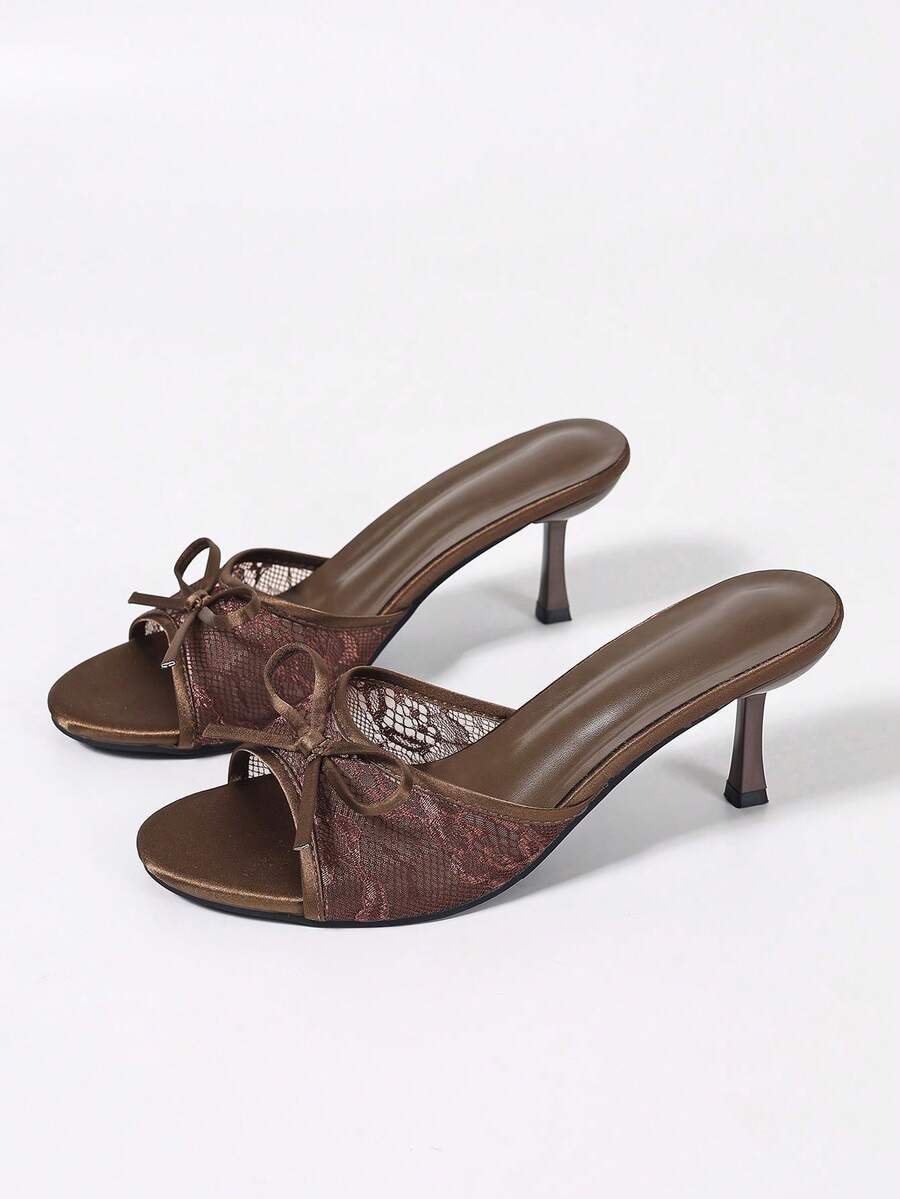 Women's black open toe mesh slide sandals with bowknot detail and stiletto heels