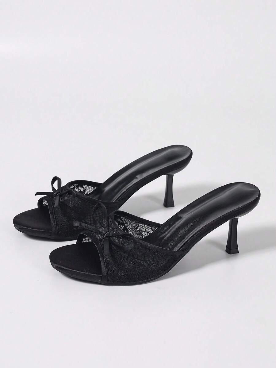 Women's black open toe mesh slide sandals with bowknot detail and stiletto heels