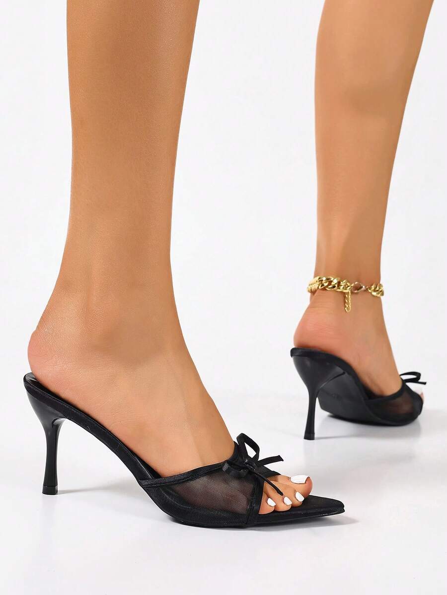 Women's black open toe mesh slide sandals with bowknot detail and stiletto heels
