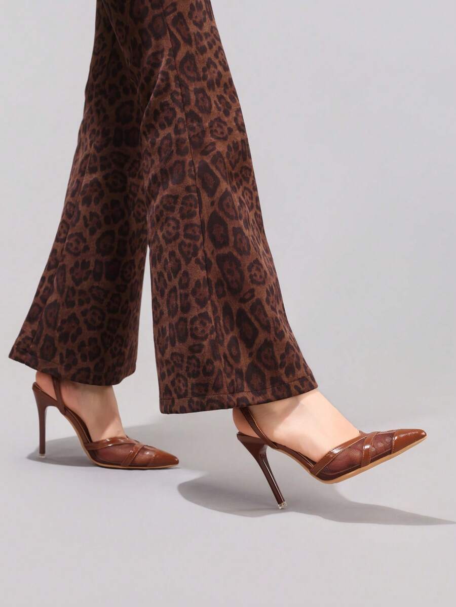 Lace embroidered high heels with thin stiletto heel, pointed toe, rhinestone embellishments, and ankle strap buckle closure.