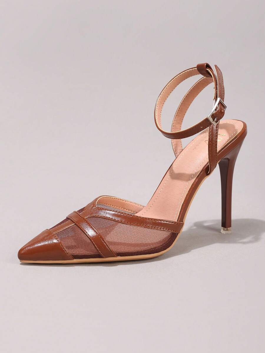 Lace embroidered high heels with thin stiletto heel, pointed toe, rhinestone embellishments, and ankle strap buckle closure.