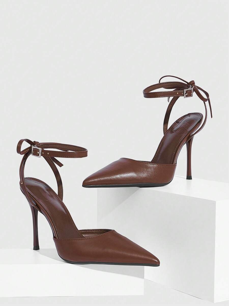 Women's pointed toe ankle strap stiletto high heel pumps featuring smooth PU leather and delicate buckle closure