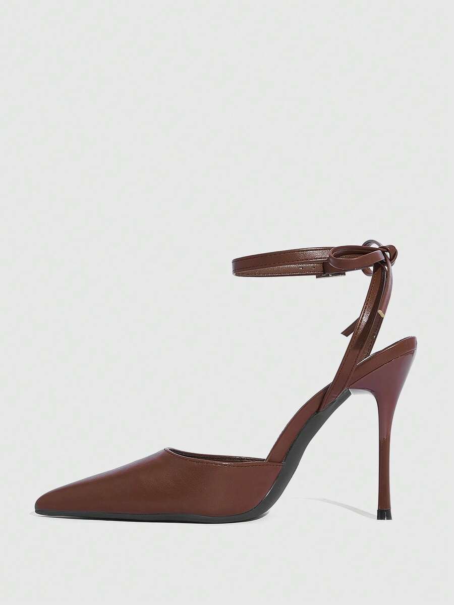 Women's pointed toe ankle strap stiletto high heel pumps featuring smooth PU leather and delicate buckle closure