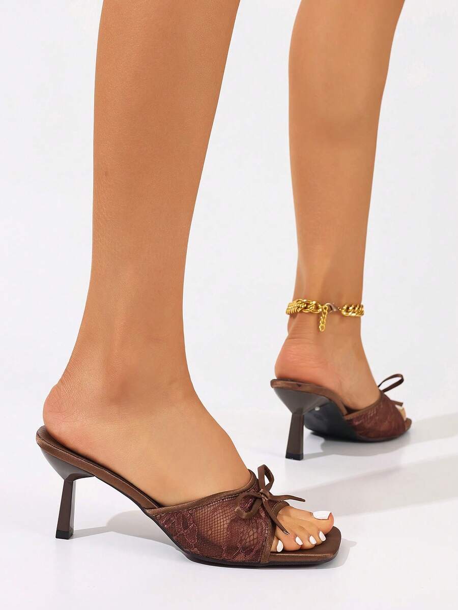 Women's black open toe mesh slide sandals with bowknot detail and stiletto heels