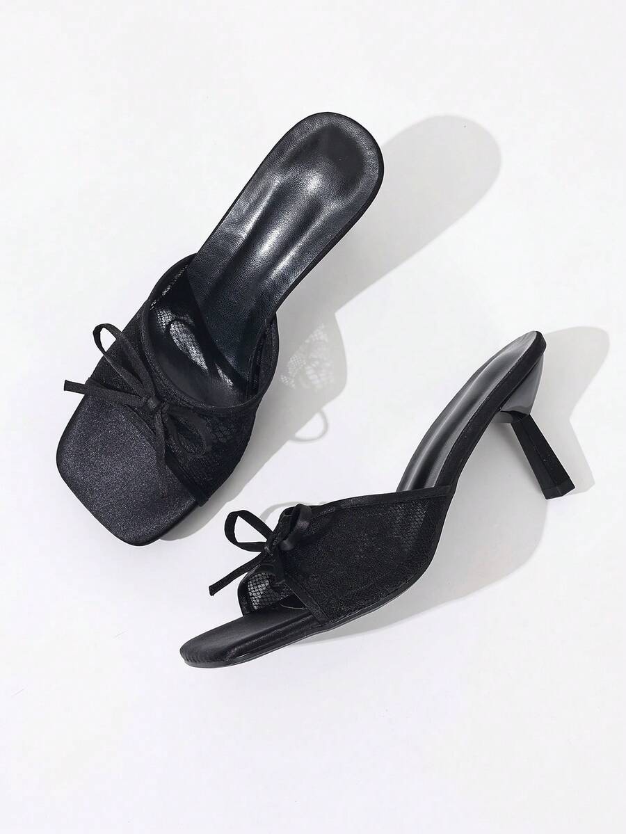 Women's black open toe mesh slide sandals with bowknot detail and stiletto heels