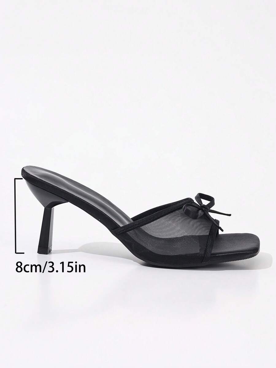 Women's black open toe mesh slide sandals with bowknot detail and stiletto heels