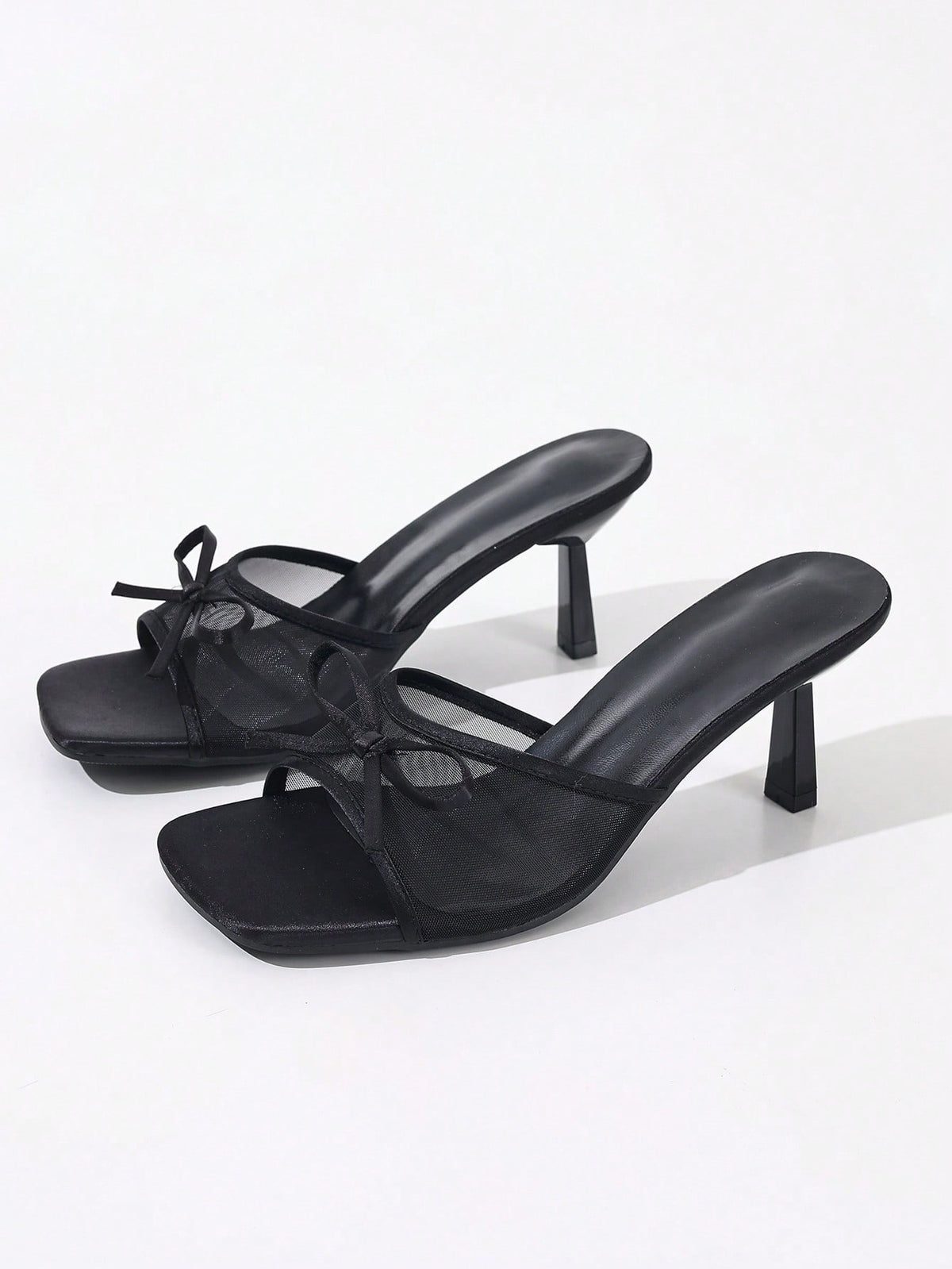 Women's black open toe mesh slide sandals with bowknot detail and stiletto heels