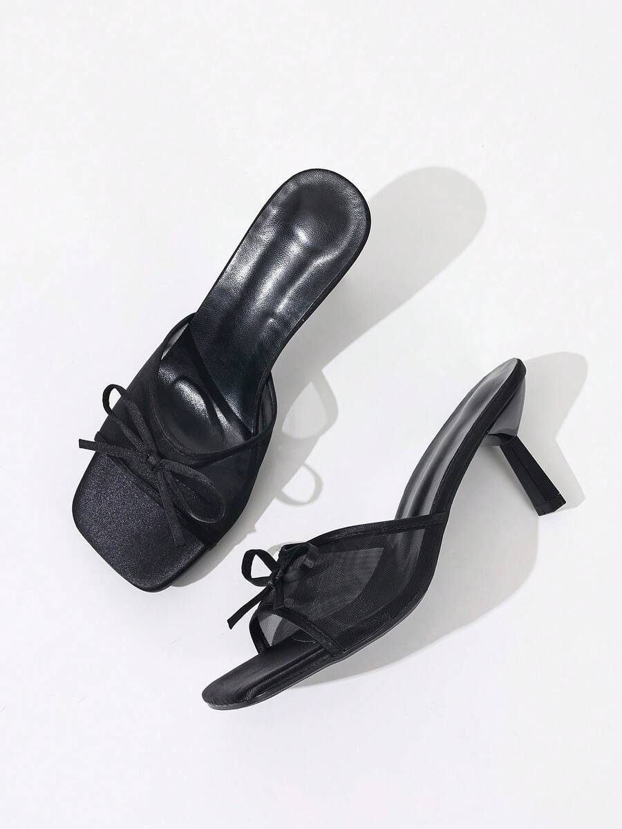 Women's black open toe mesh slide sandals with bowknot detail and stiletto heels