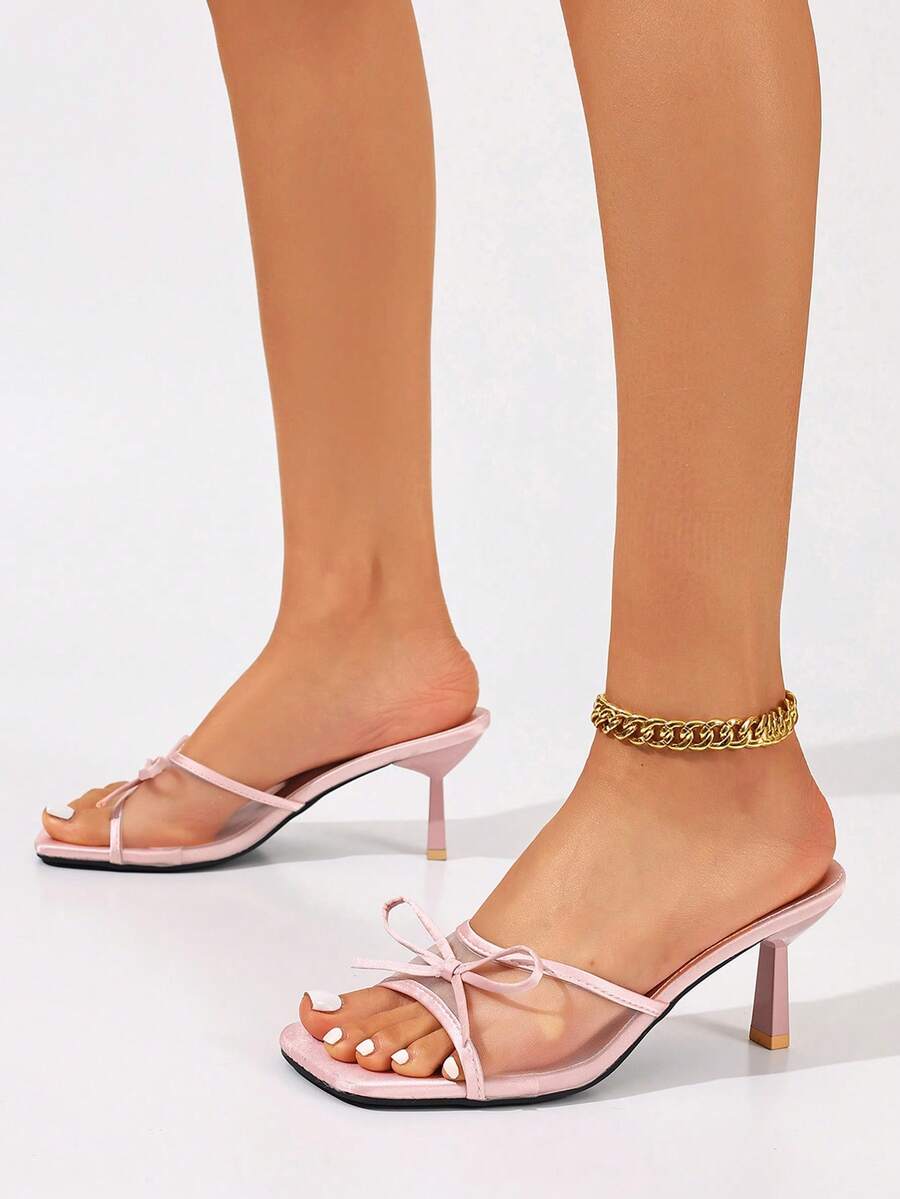 Women's black open toe mesh slide sandals with bowknot detail and stiletto heels