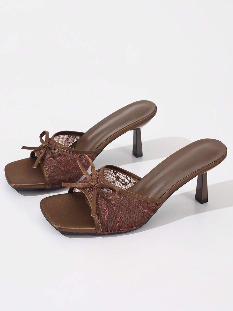 Women's black open toe mesh slide sandals with bowknot detail and stiletto heels