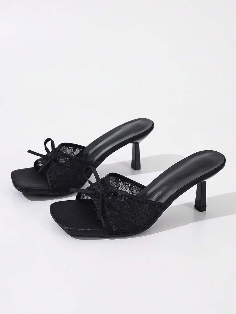 Women's black open toe mesh slide sandals with bowknot detail and stiletto heels