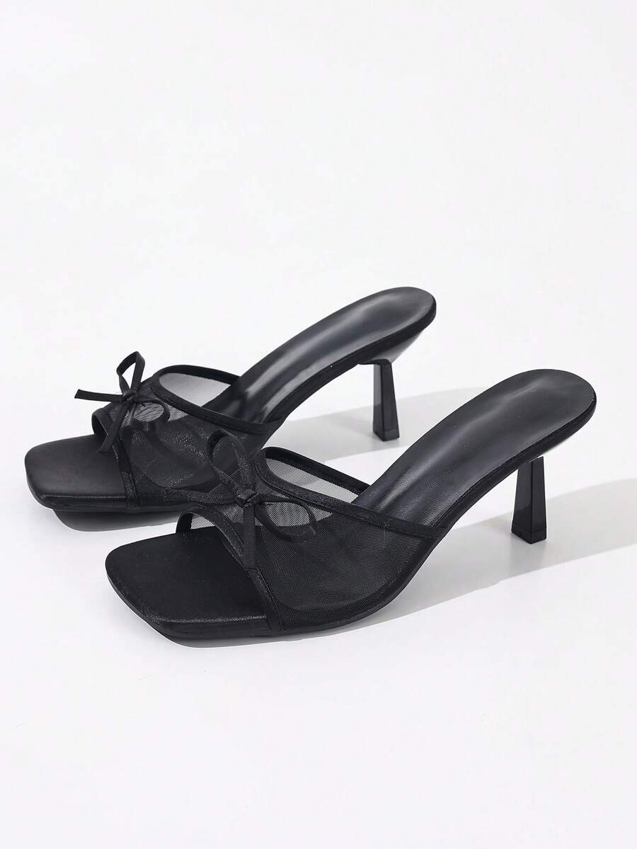 Women's black open toe mesh slide sandals with bowknot detail and stiletto heels
