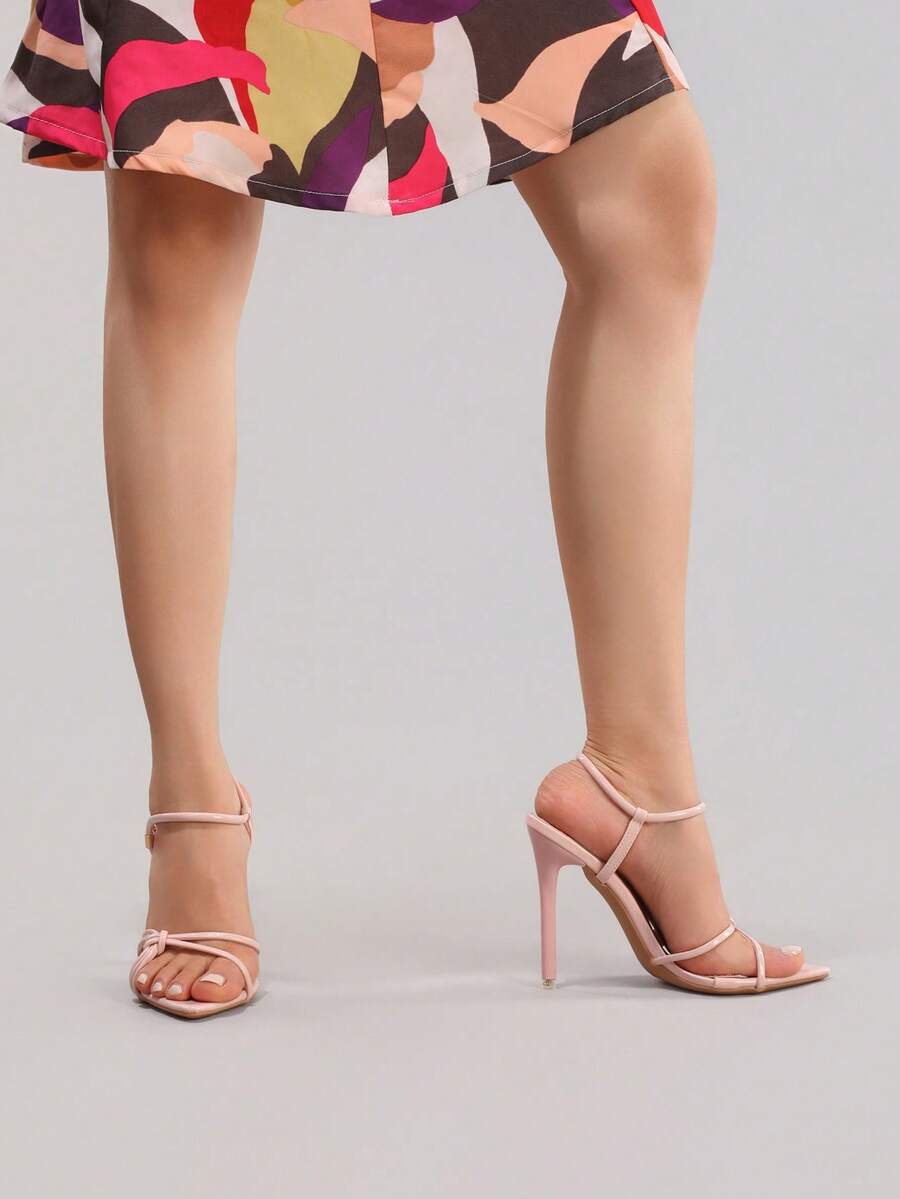 Lace stiletto high heel sandals with pointed open toe, ankle strap buckle, and bow detail