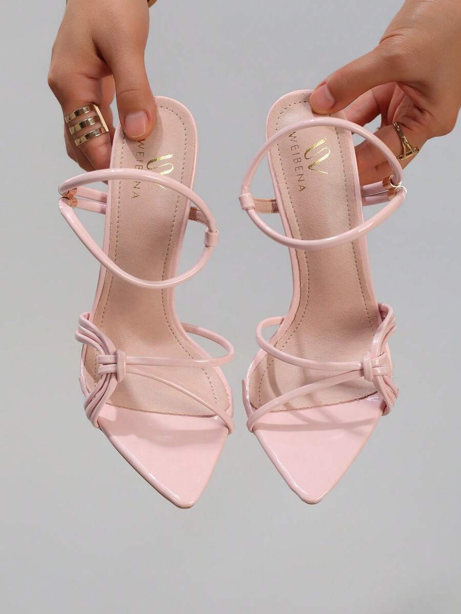 Lace stiletto high heel sandals with pointed open toe, ankle strap buckle, and bow detail