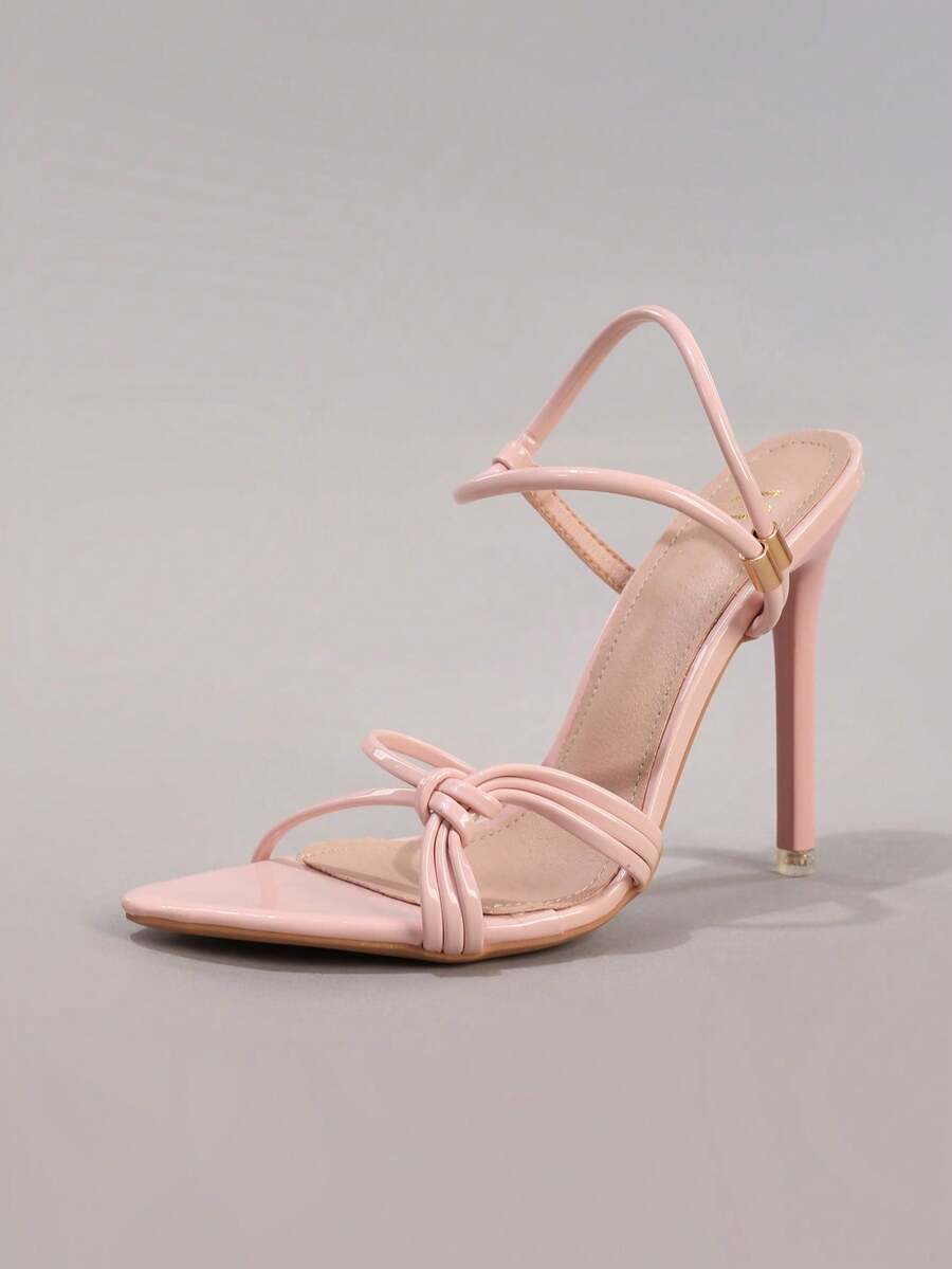 Lace stiletto high heel sandals with pointed open toe, ankle strap buckle, and bow detail