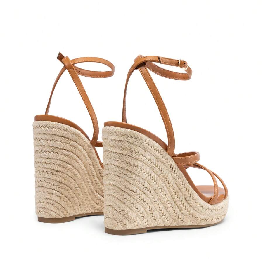 Women's strappy espadrille platform wedge sandals featuring an open toe design and adjustable ankle buckle strap