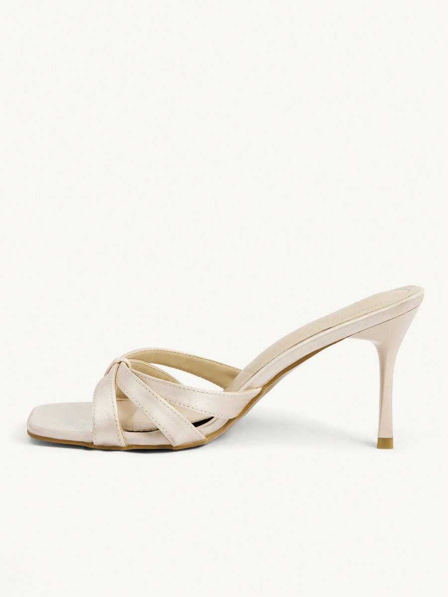 Square toe gold metallic heel sandals for women featuring open toe, crossover slingback strap, and stiletto mid heel for weddings and parties.