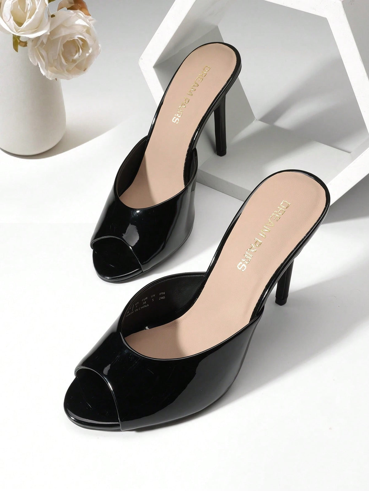 Women's peep toe stiletto mule sandals in white featuring a sleek high heel and slip-on design for party and wedding wear.