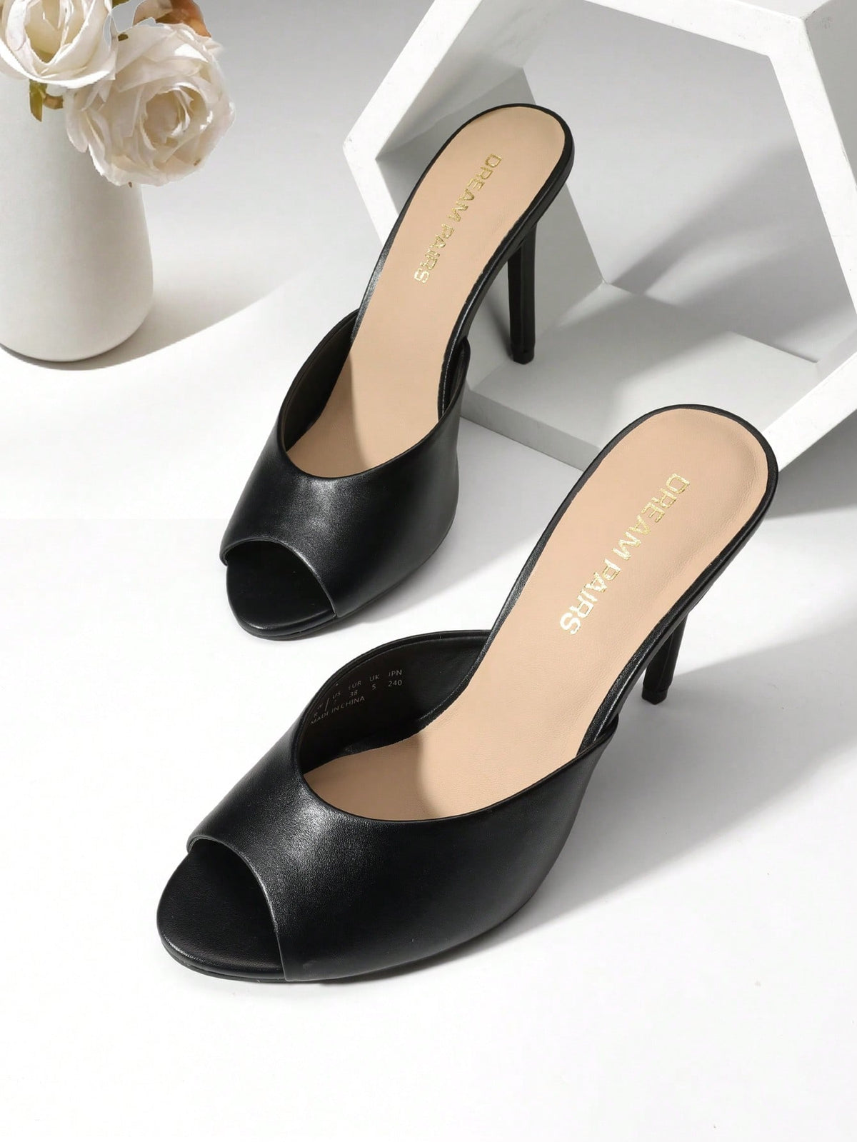 Women's peep toe stiletto mule sandals in white featuring a sleek high heel and slip-on design for party and wedding wear.