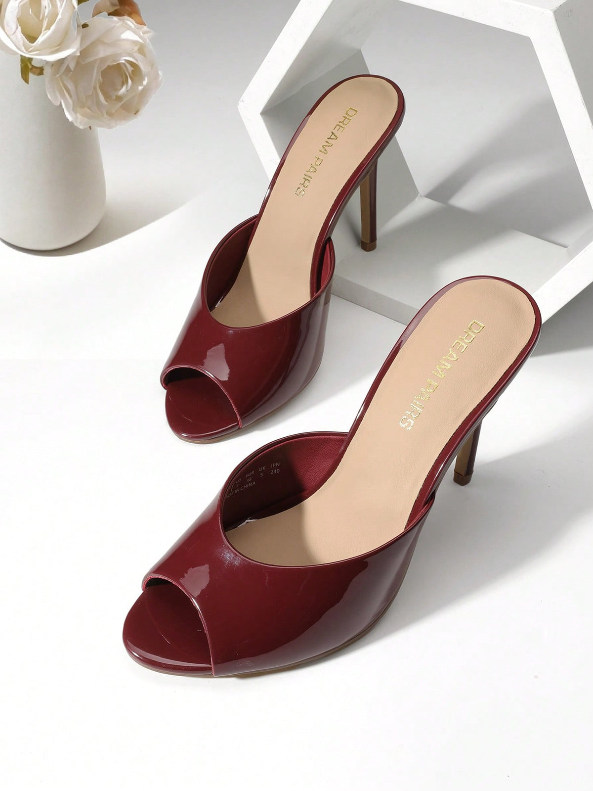 Women's peep toe stiletto mule sandals in white featuring a sleek high heel and slip-on design for party and wedding wear.