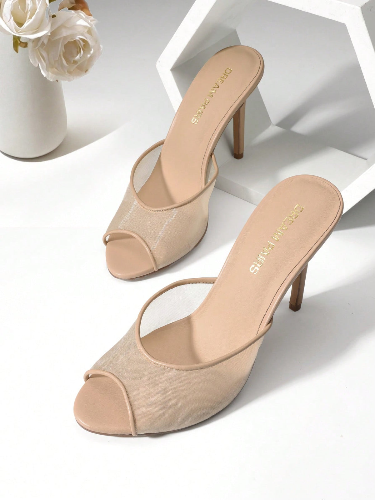 Women's peep toe stiletto mule sandals in white featuring a sleek high heel and slip-on design for party and wedding wear.