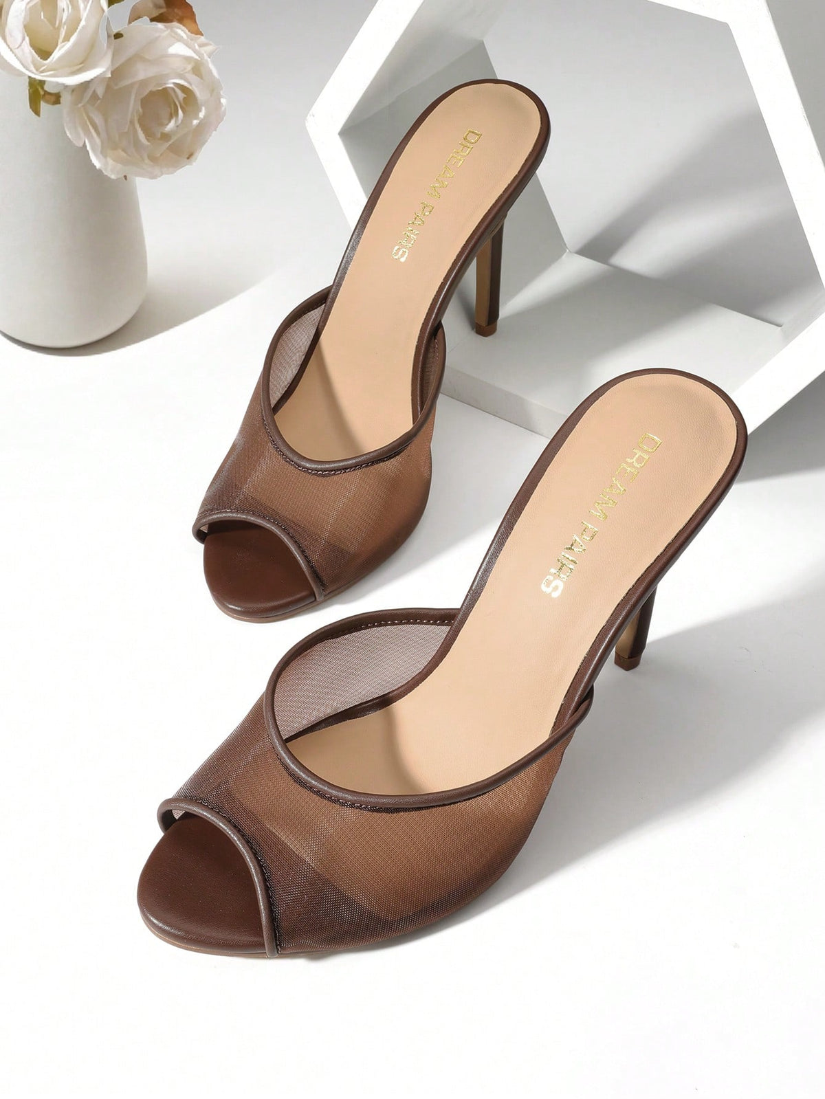 Women's peep toe stiletto mule sandals in white featuring a sleek high heel and slip-on design for party and wedding wear.