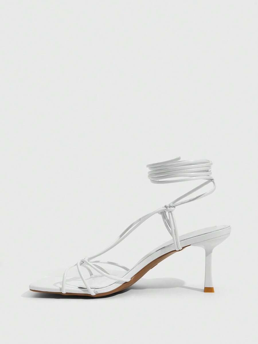 Women's square toe stiletto heel slingback sandals featuring sleek straps and buckle closure in a backless design.