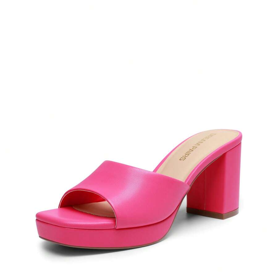 Women's minimalist open toe mule sandals featuring a chunky low heel, wide single strap, and slip-on design.