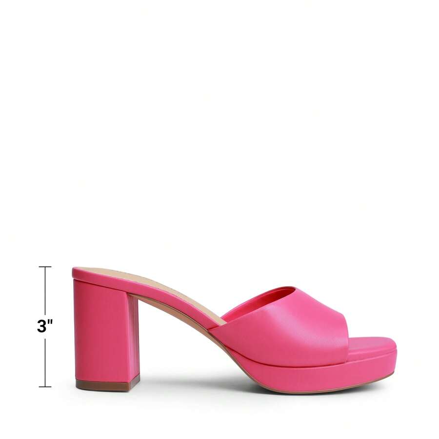 Women's minimalist open toe mule sandals featuring a chunky low heel, wide single strap, and slip-on design.