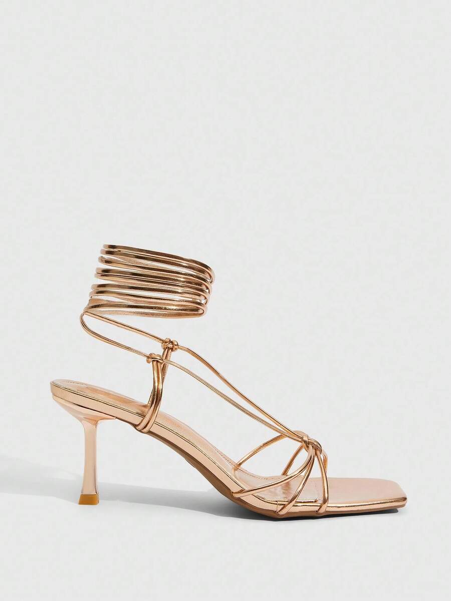 Women's square toe stiletto heel slingback sandals featuring sleek straps and buckle closure in a backless design.