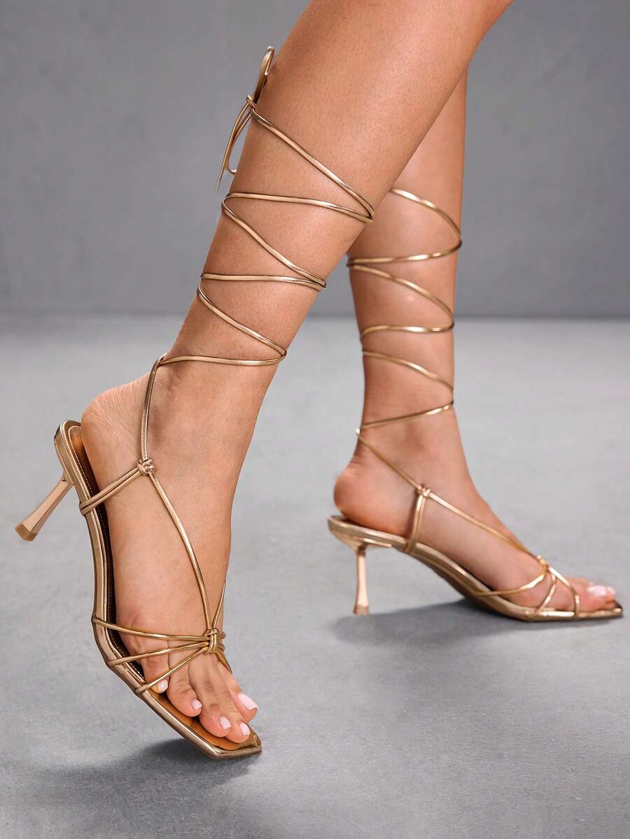 Women's square toe stiletto heel slingback sandals featuring sleek straps and buckle closure in a backless design.