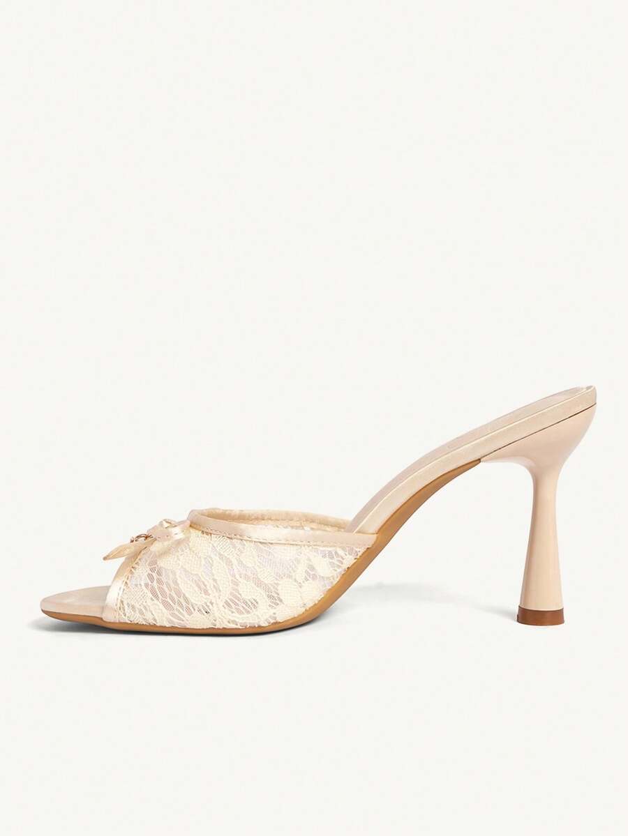 Elegant women's pointed toe high heel mules crafted from smooth PU leather with stiletto heels and delicate bow detail.