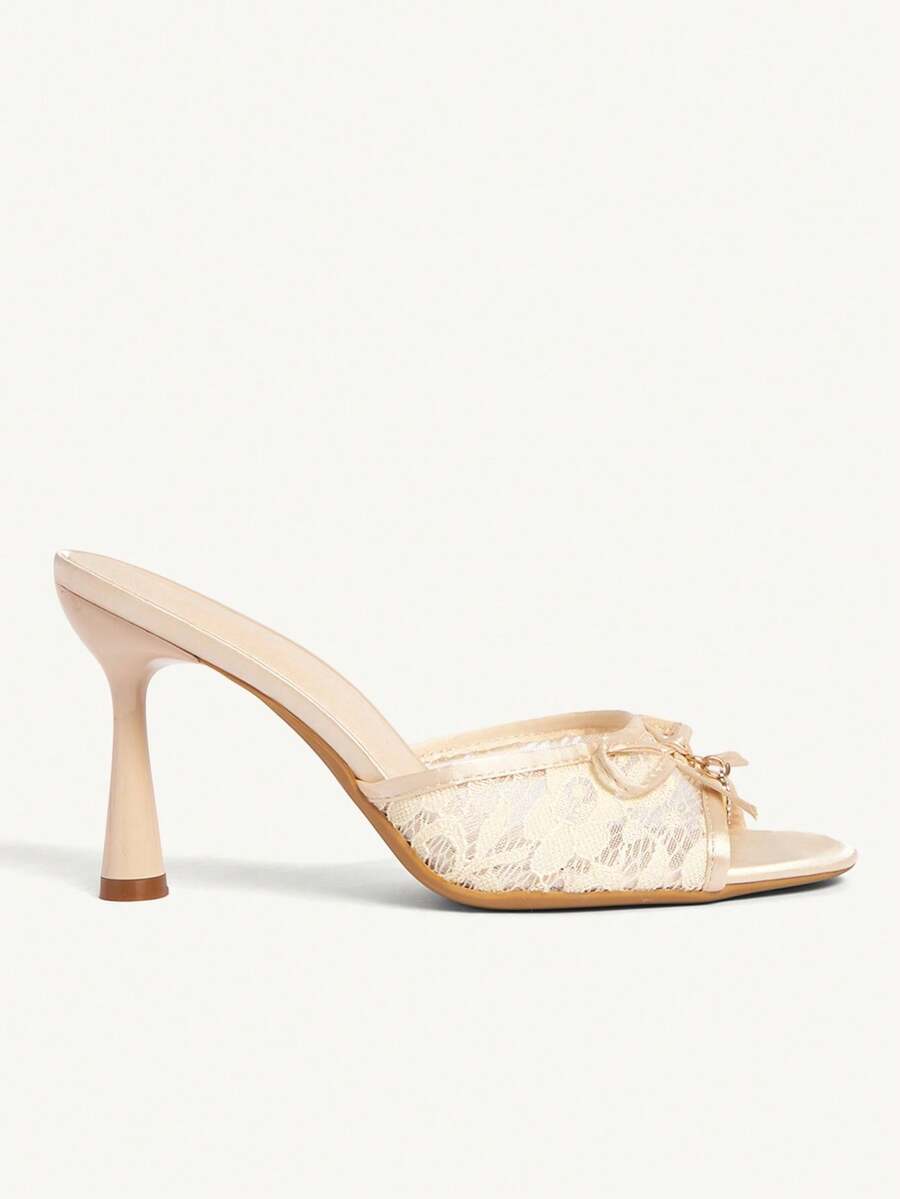 Elegant women's pointed toe high heel mules crafted from smooth PU leather with stiletto heels and delicate bow detail.