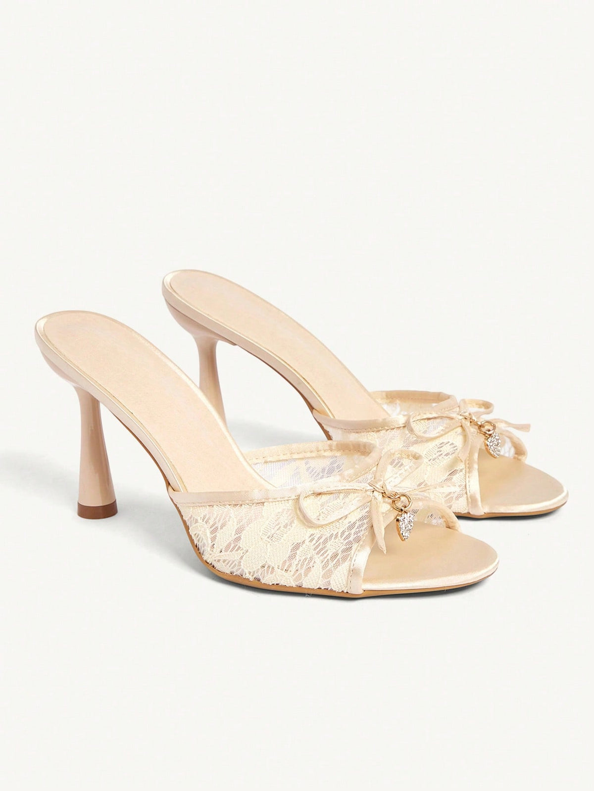Elegant women's pointed toe high heel mules crafted from smooth PU leather with stiletto heels and delicate bow detail.