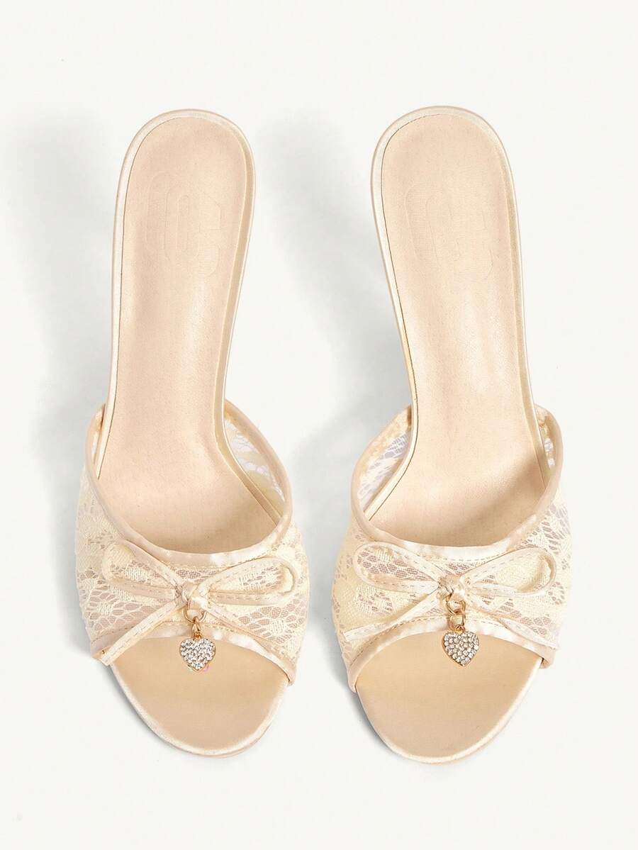 Elegant women's pointed toe high heel mules crafted from smooth PU leather with stiletto heels and delicate bow detail.