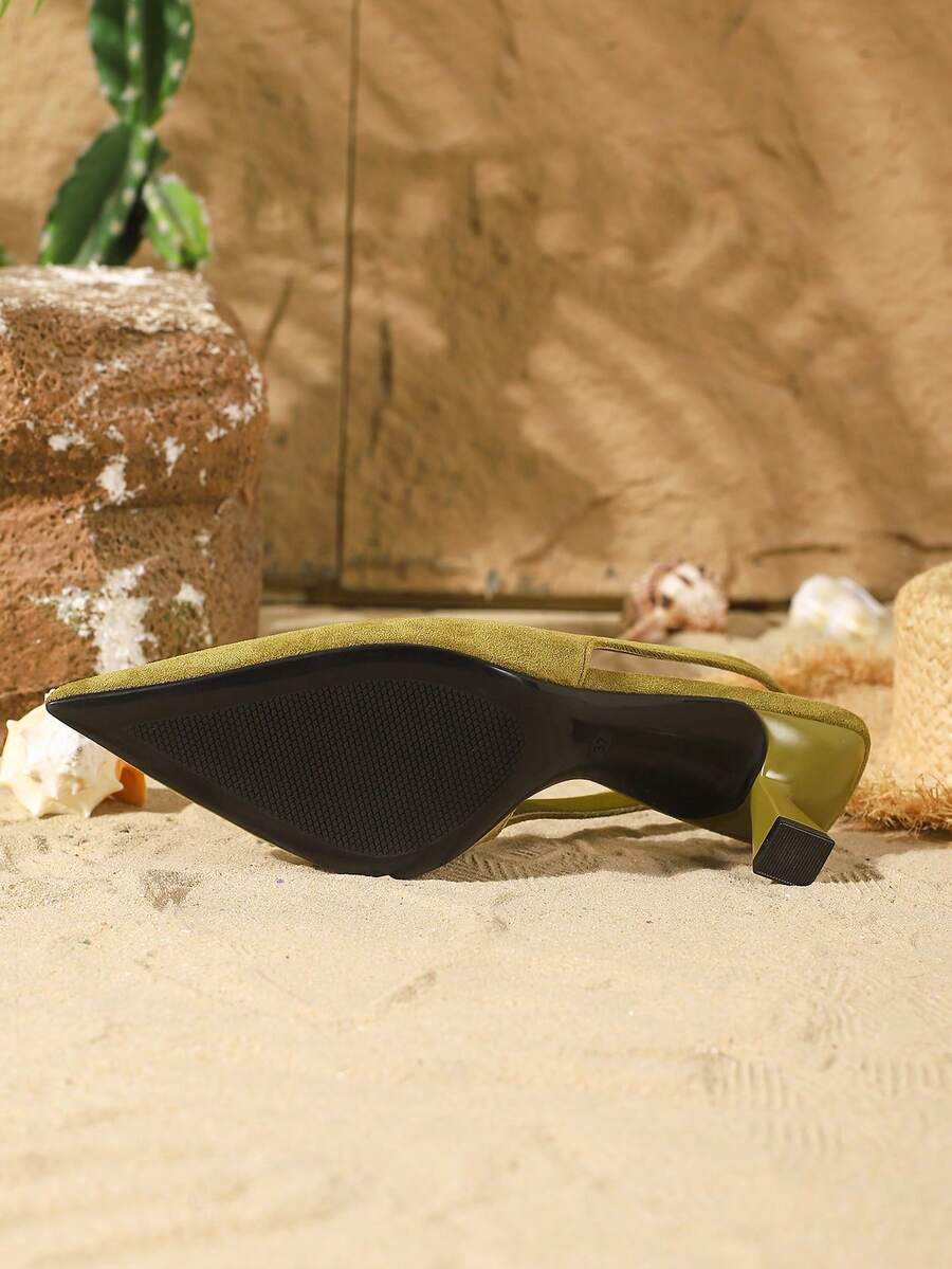 Women's elegant velvet kitten heel slingback pumps featuring a pointed closed toe and slip-on strap design.
