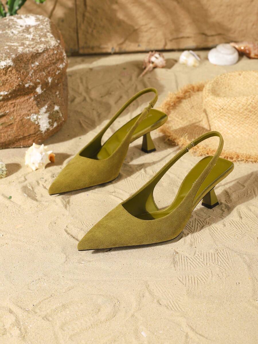 Women's elegant velvet kitten heel slingback pumps featuring a pointed closed toe and slip-on strap design.