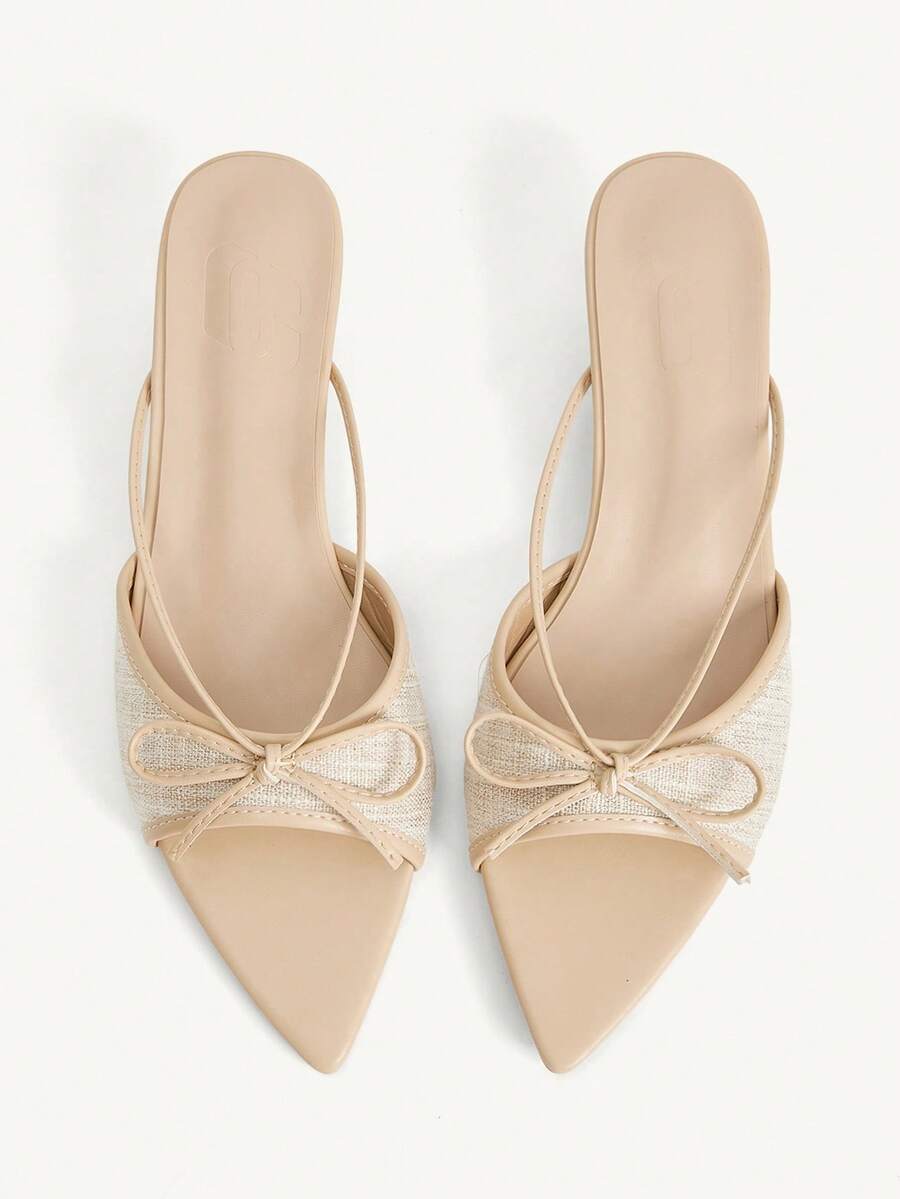 Pointed toe high-heeled slippers in PU leather with decorative buckle detail and low kitten heels for women.