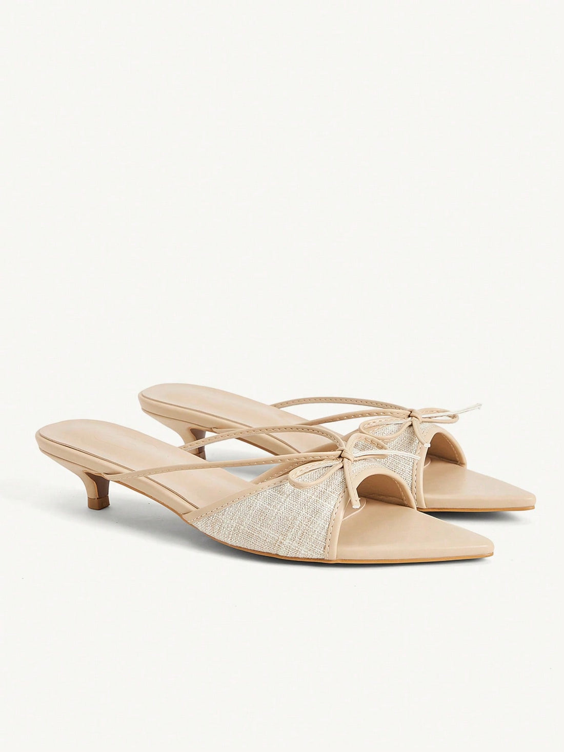 Pointed toe high-heeled slippers in PU leather with decorative buckle detail and low kitten heels for women.