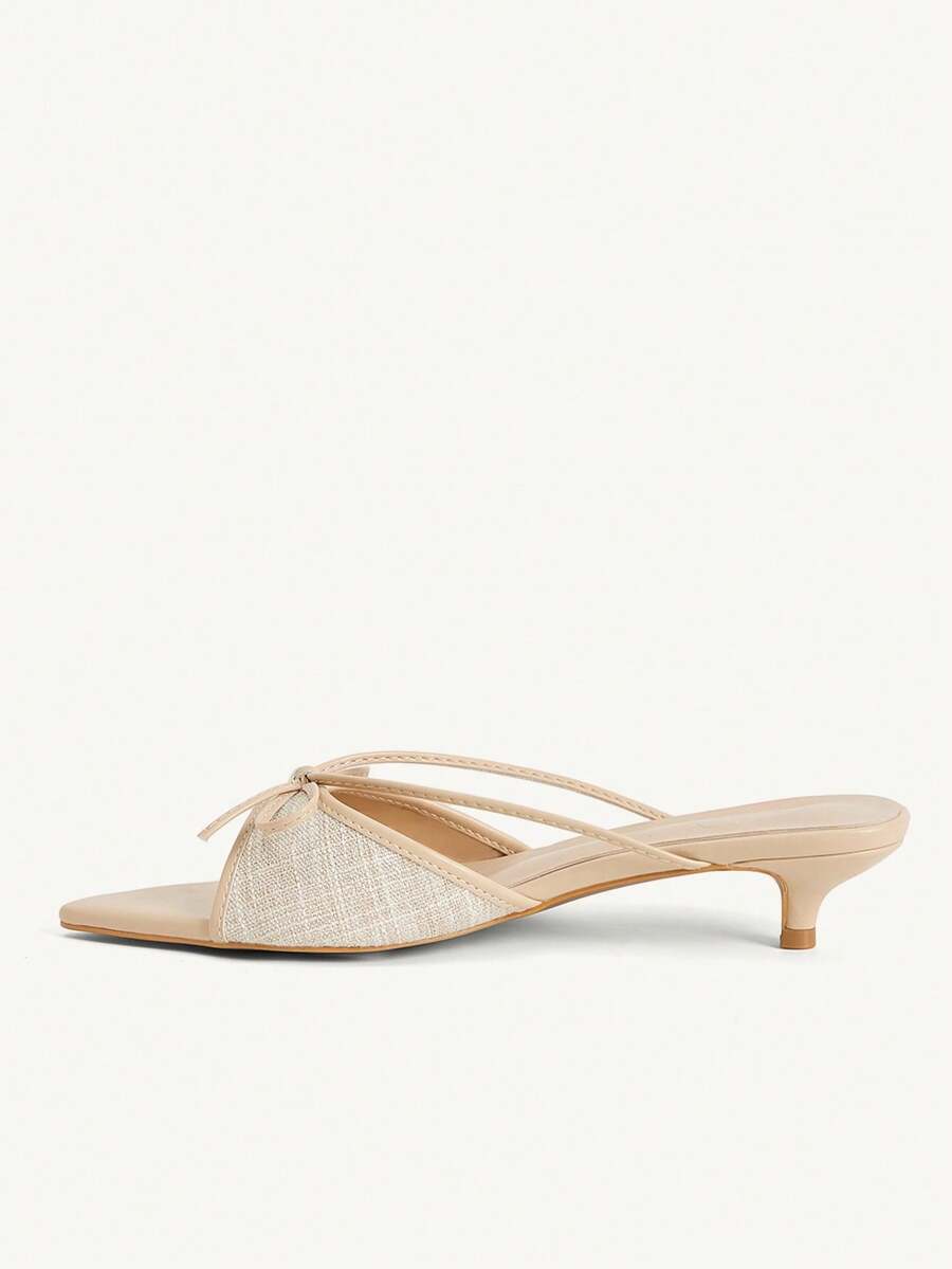 Pointed toe high-heeled slippers in PU leather with decorative buckle detail and low kitten heels for women.
