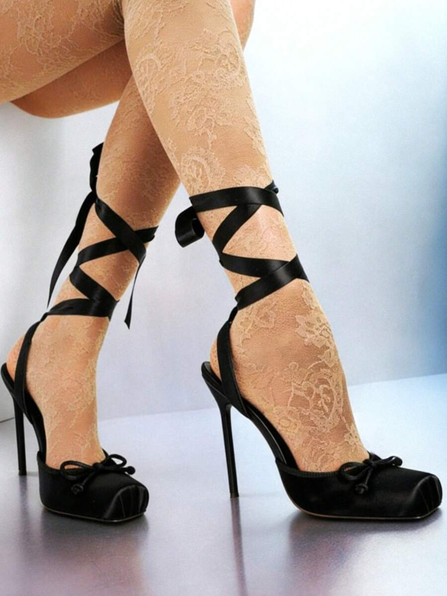 Women's square toe satin ballet stiletto heels with lace-up straps and bow detail.